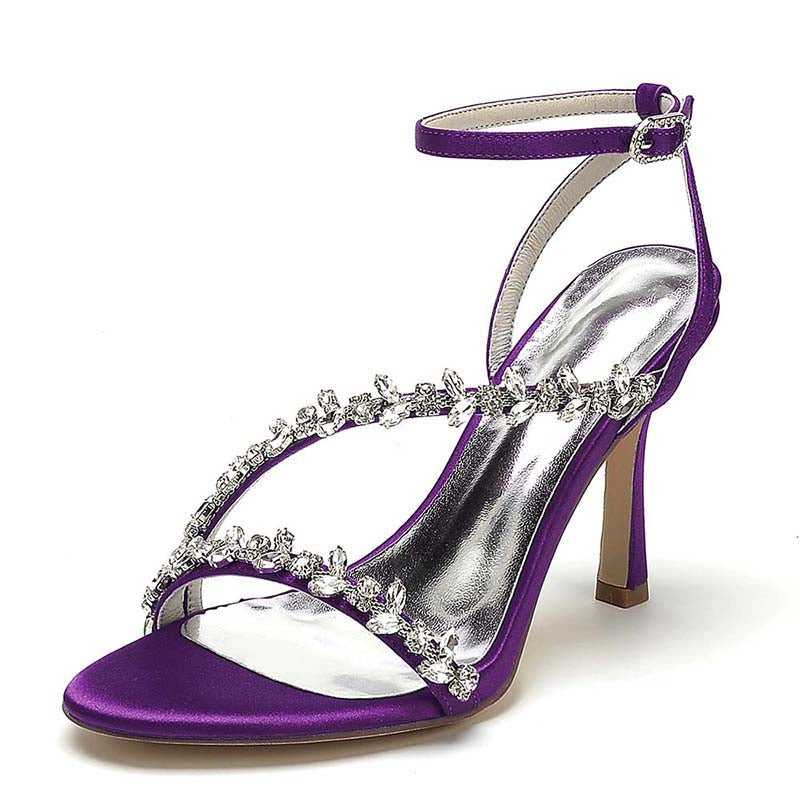 Purple high-heeled sandal with crystal embellishments on a white background
