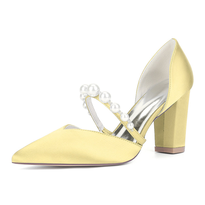 Yellow high-heeled shoes with pearl straps on a white background
