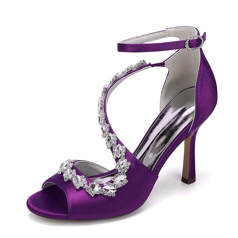 Purple high-heeled sandal with crystal embellishments on a white background