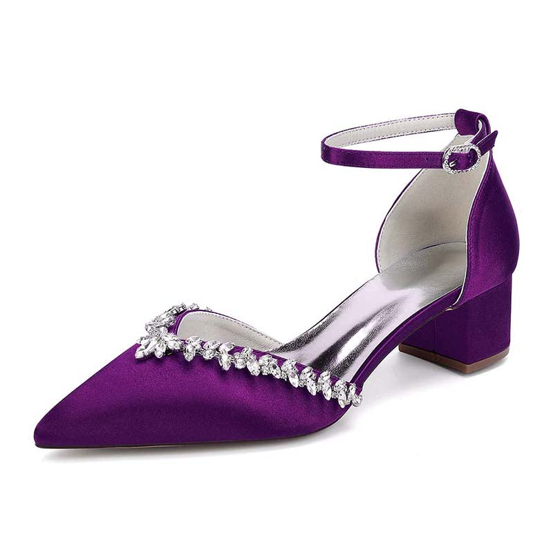 Purple high-heeled shoe with crystal embellishments on a white background