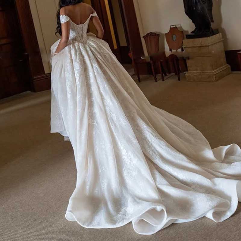 Off-Shoulder Lace Ball Gown Wedding Dress – High Slit & Corset Bodice