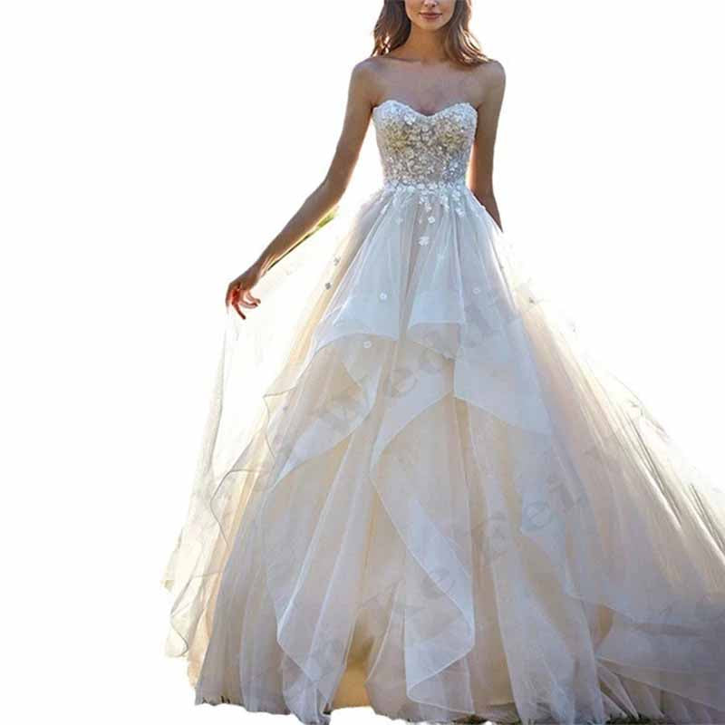 Elegant SD Dresscode boho wedding dress with ruffles featuring a strapless design and intricate embellishments