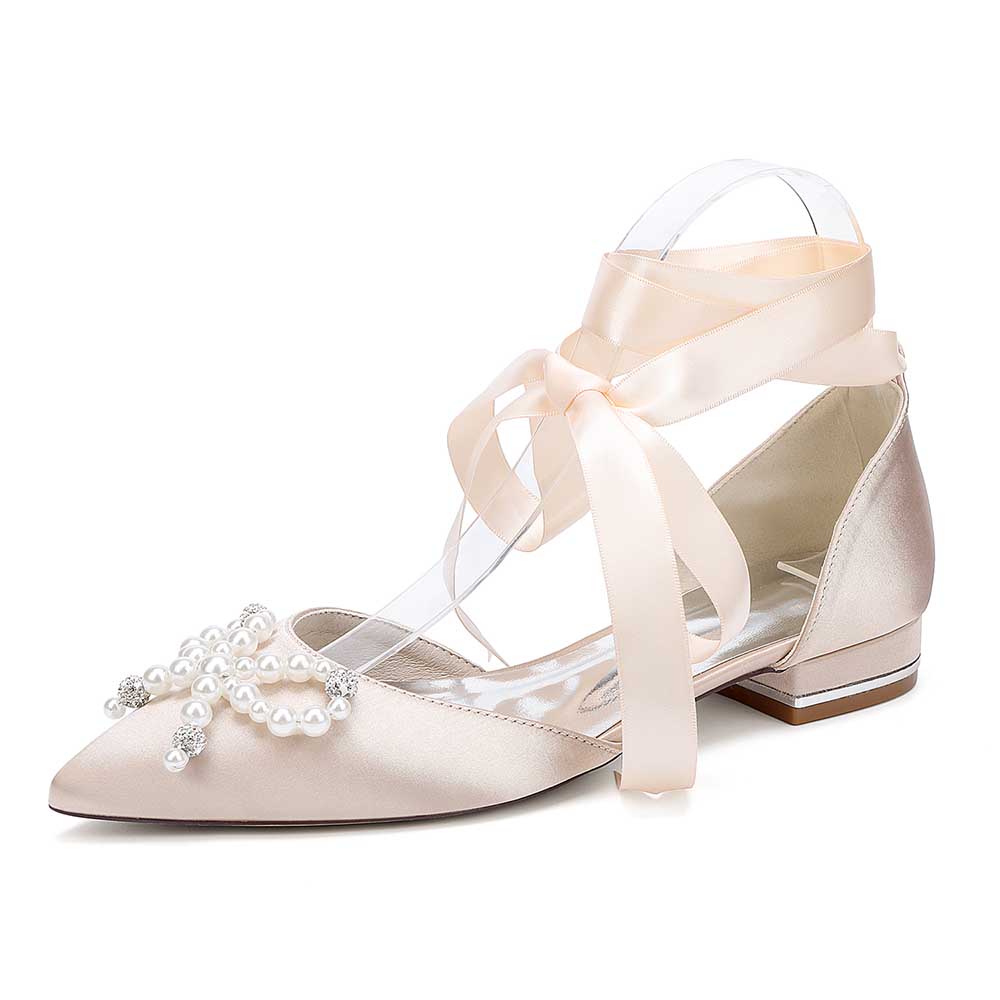 Elegant bridal ankle strap flat shoes with pearl embellishments and satin ribbon in soft beige