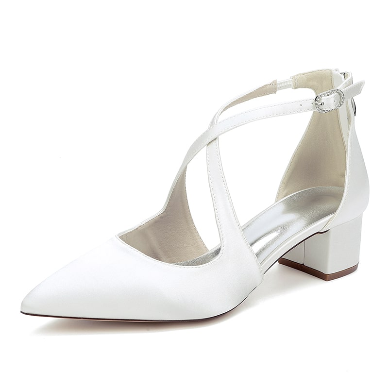 Elegant white bridal heels with crossing straps and a comfortable block heel for stylish weddings