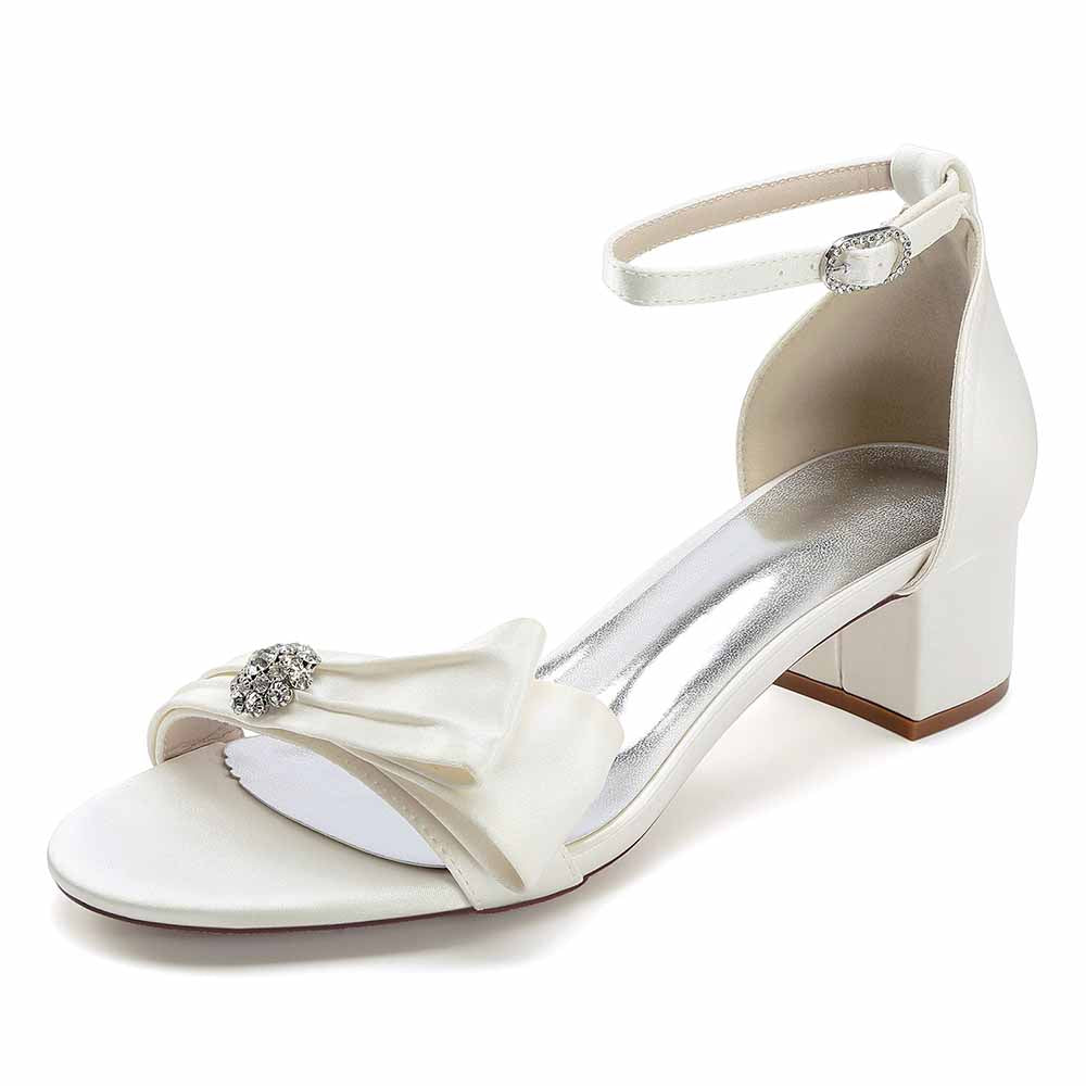 Elegant chunky heel wedding sandals with bow detail and ankle strap for stylish brides