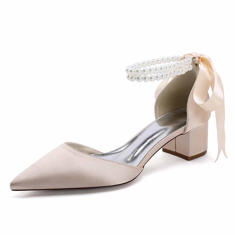 Elegant closed toe wedding heels for bride featuring a pearl ankle strap and block heel