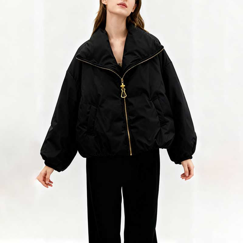 Stylish black cotton padded winter jacket for women with a zippered front and oversized silhouette
