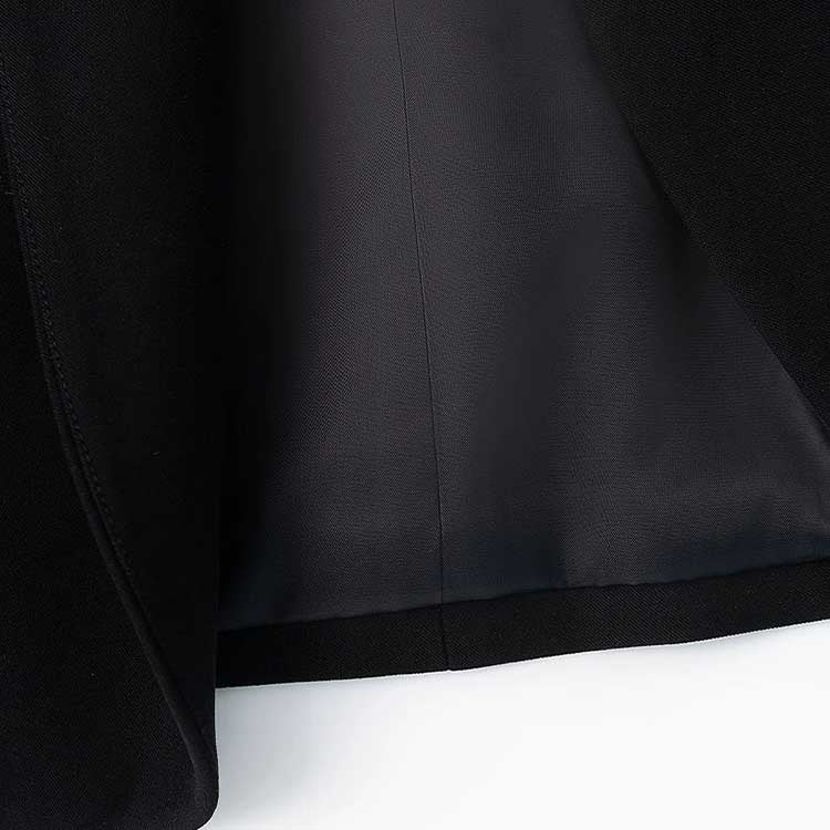 Interior view of a rhinestone embellished black blazer showcasing the sleek black lining and stylish design