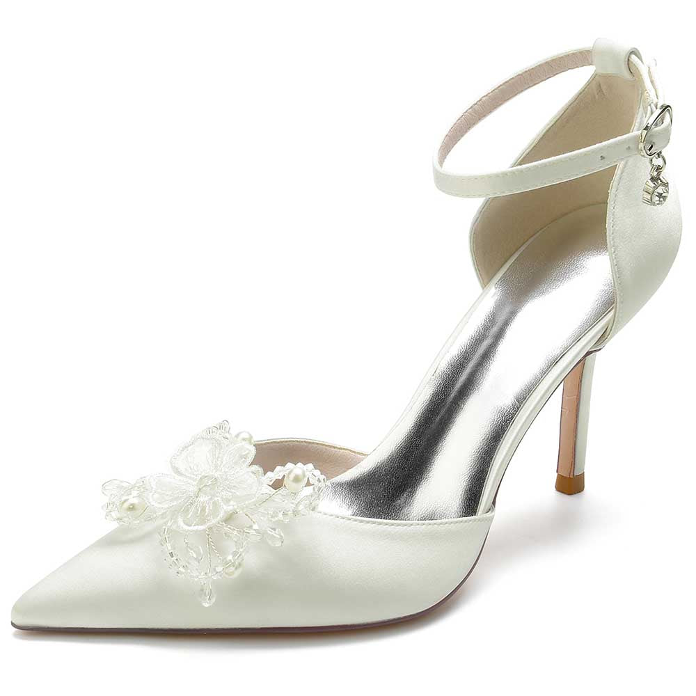 Elegant satin bridal heels with crystals featuring floral embellishments and a chic ankle strap