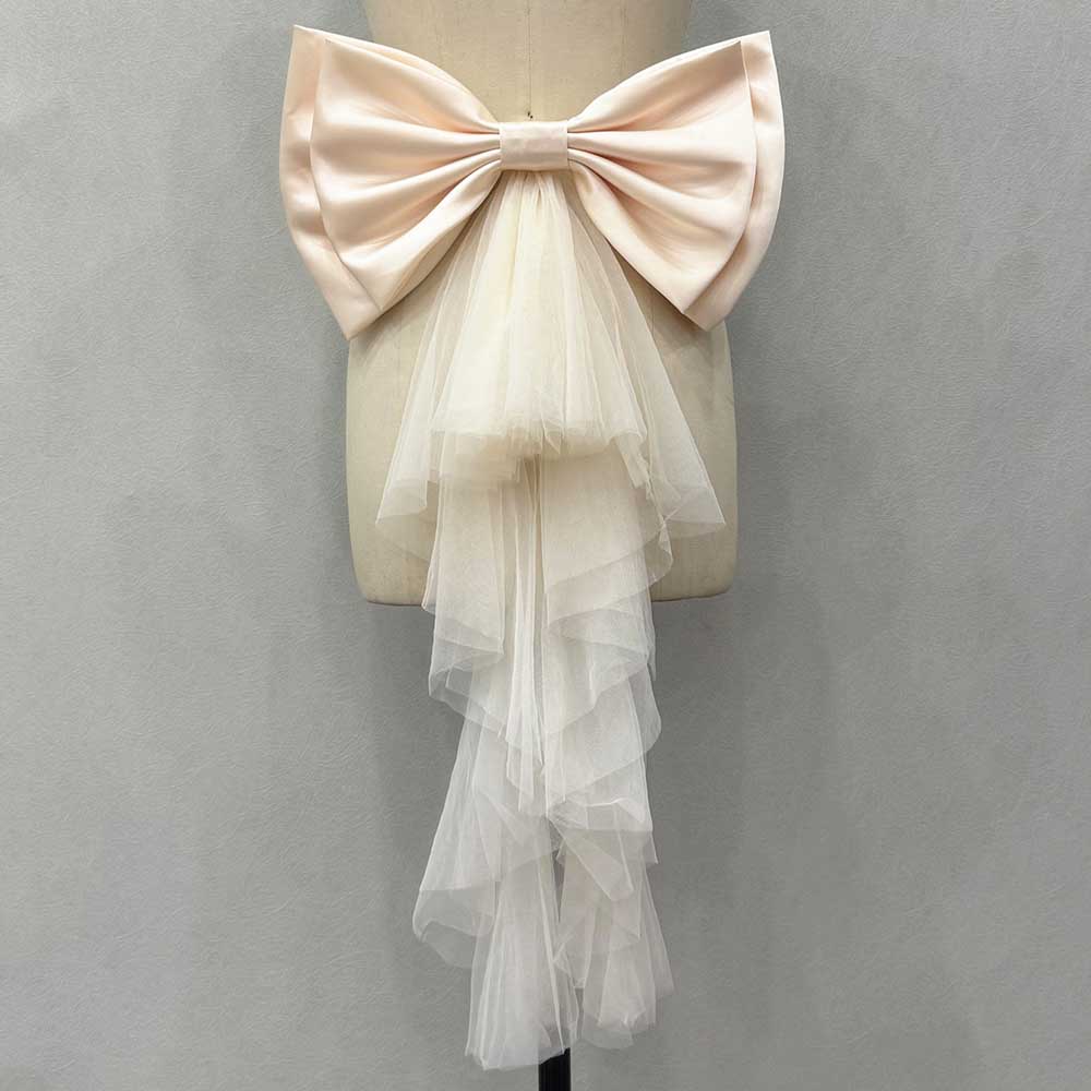Satin wedding bow for bridal dress with layered tulle cascading from the center for an elegant look