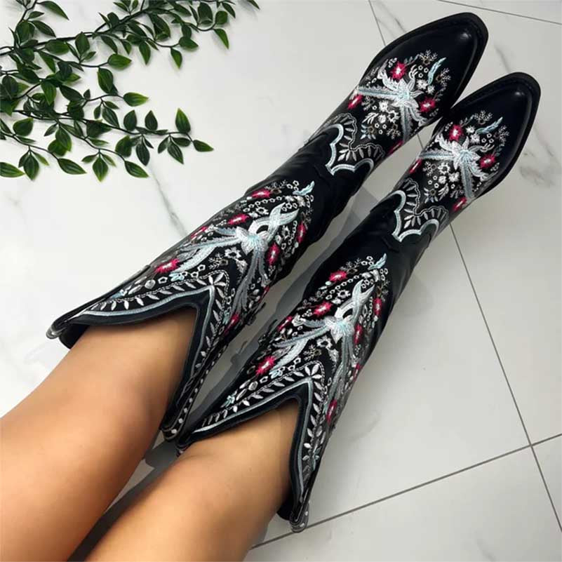 Women's black embroidered cowboy boots featuring vibrant floral designs and a stylish silhouette