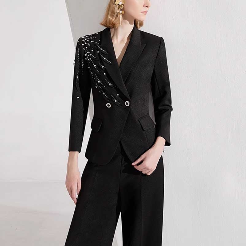 Elegant women's black formal pantsuit featuring a stylish embellished blazer with intricate detailing