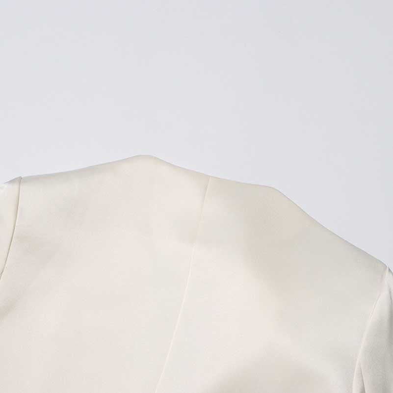 Elegant women's maxi blazer coat in cream color, perfect for layering over outfits