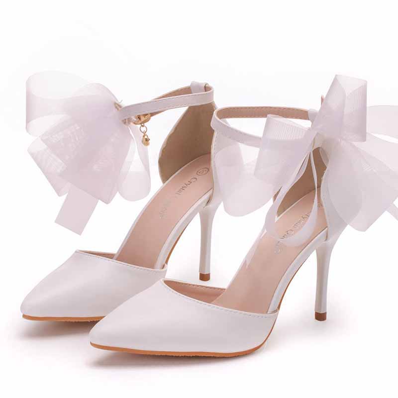 bridal closed toe high heel sandals with elegant bows for a stylish wedding look