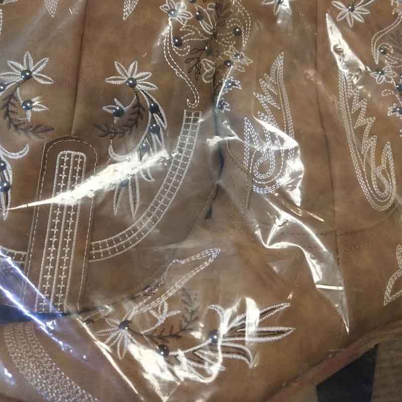 Close-up of floral embroidery wedding boots showcasing intricate designs and detailing