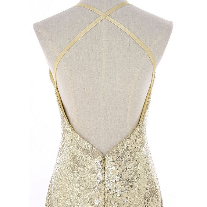 Back view of a glamorous evening mermaid dress with crisscross straps in shimmering gold sequins