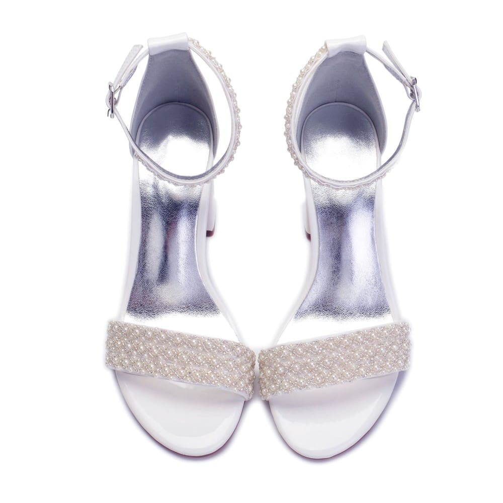 Elegant white high heel wedding shoes with embellished strap and ankle buckle for bridal elegance
