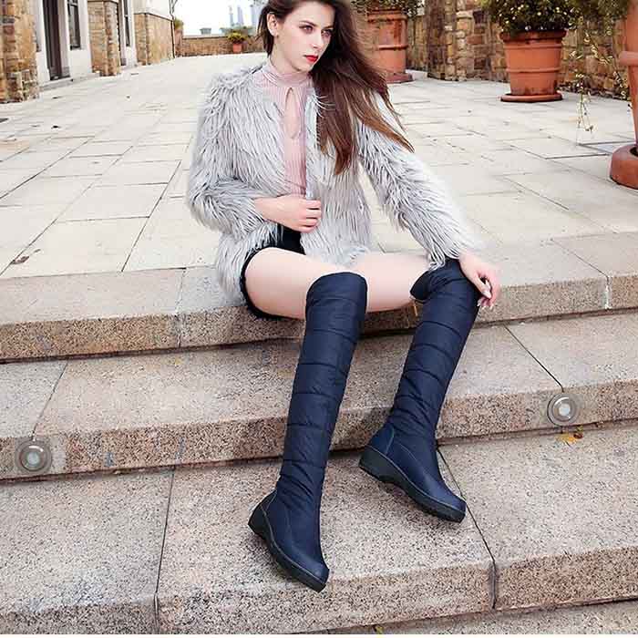 Womens over the knee snow boots in navy, stylish and warm for winter wear.
