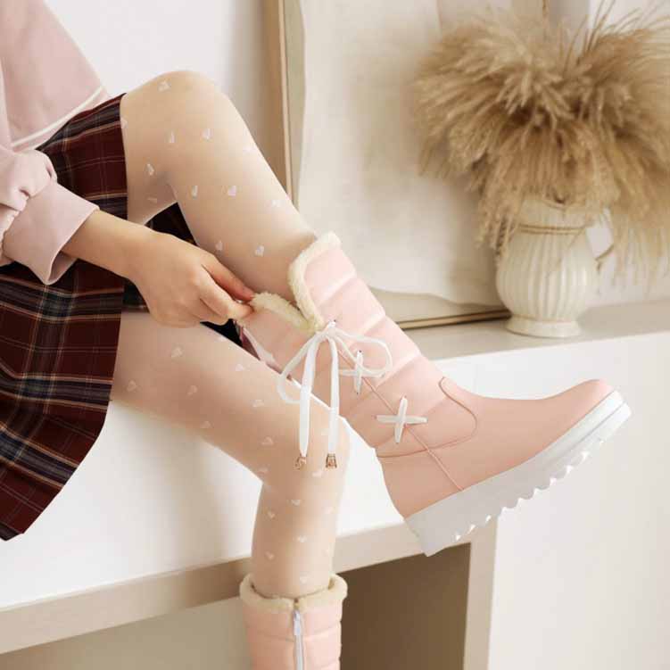 Stylish pink women's waterproof winter boots with cozy lining for cold weather protection