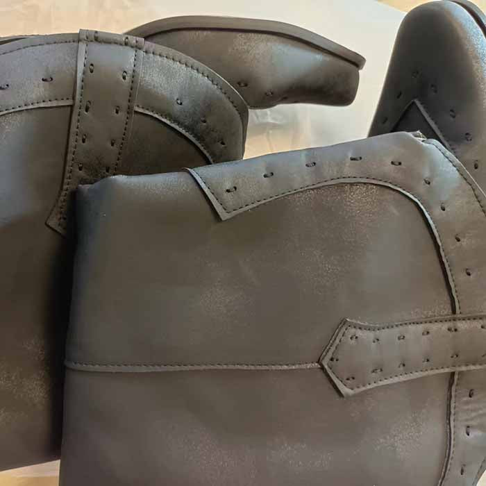 Stylish women's western short wedding boots in sleek black leather for elegant bridal outfits