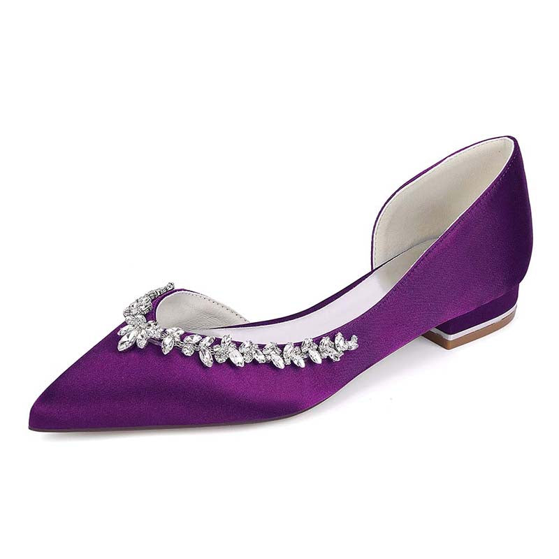 Purple shoe with decorative embellishments on a white background