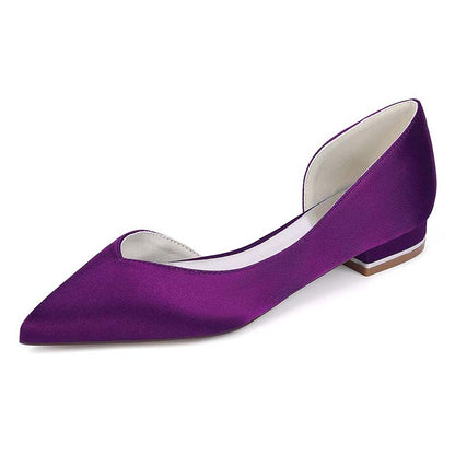 Purple shoe with a white sole on a white background