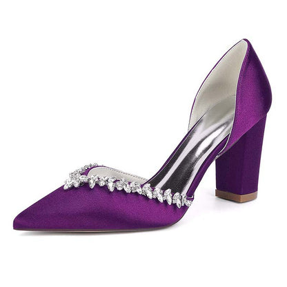 Purple high-heeled shoe with crystal embellishments on a white background