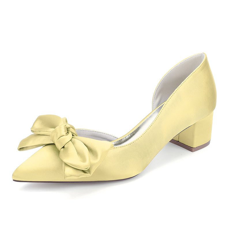 Yellow shoe with a bow on a white background