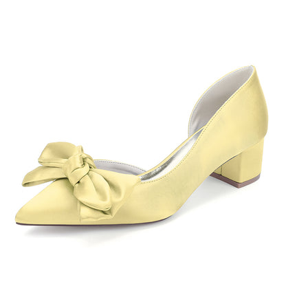 Yellow shoe with a bow on a white background
