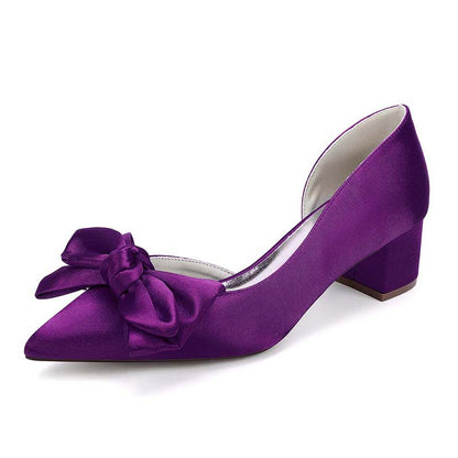 Purple shoe with a bow on a white background