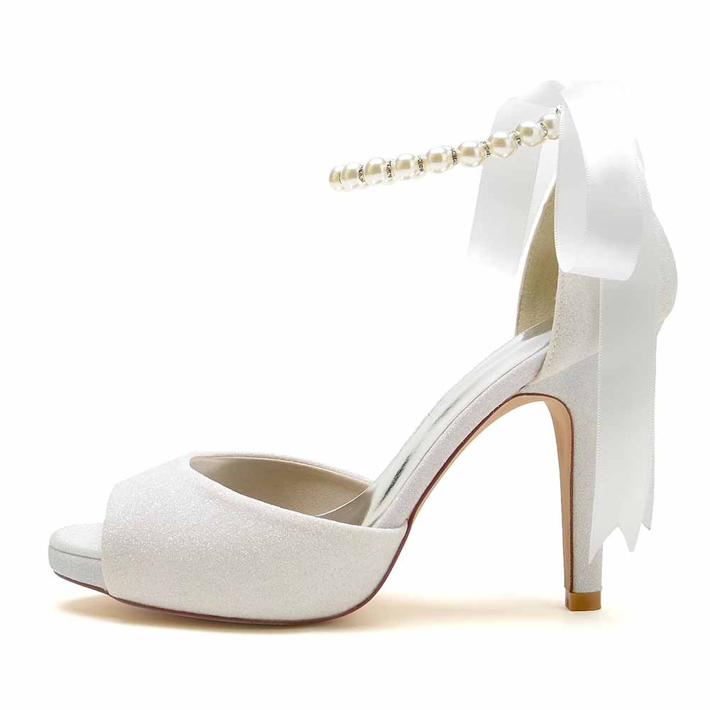 Elegant bridal shoes with pearls and ribbon featuring a chic peep-toe design and high heel
