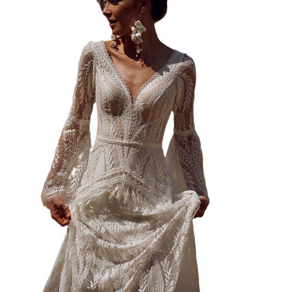 Elegant lace wedding dress with long sleeves on a white background