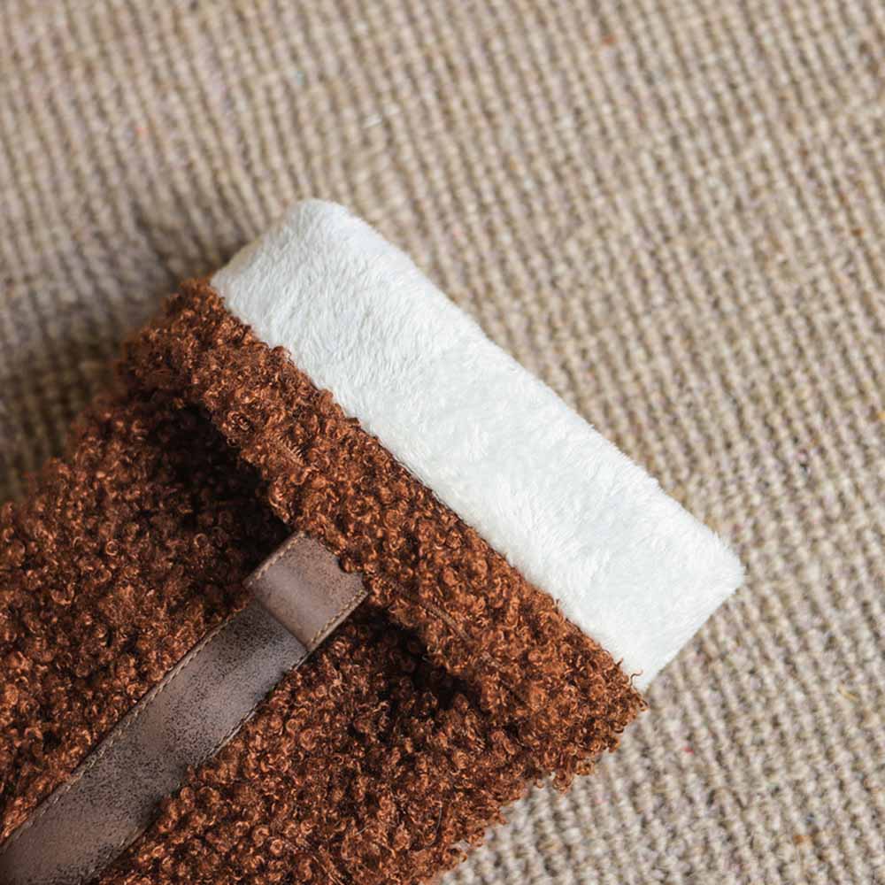 Close-up of women's fur detail calf boots featuring a soft brown and white texture
