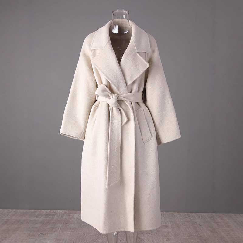 Elegant mid-length wool coat stylish comfort with a belted waist in soft cream color