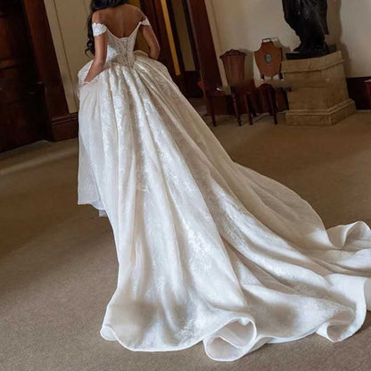 Off-Shoulder Lace Ball Gown Wedding Dress – High Slit & Corset Bodice