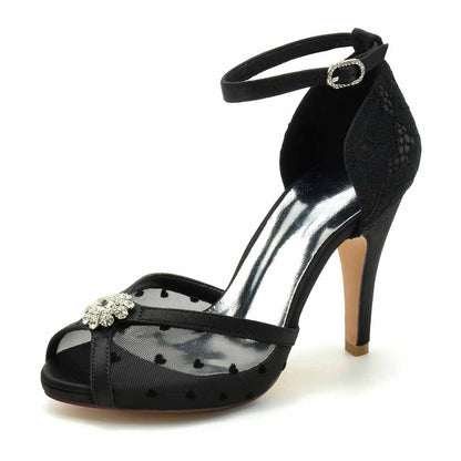 Elegant wedding pumps with lace, featuring a floral embellishment and ankle strap in black