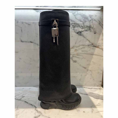 Stylish women's padlock knee high boots in black with a unique design for fashionable outfits