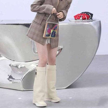 Stylish woman's outfit featuring women's padlock knee high boots paired with a blazer