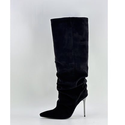 Black knee-high boot with a pointed toe and high heel on a white background