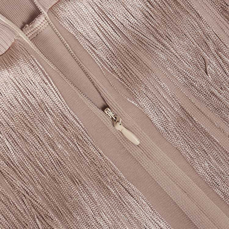 Close-up of elegant sleeveless tassel midi dress showcasing intricate fabric and zipper detail