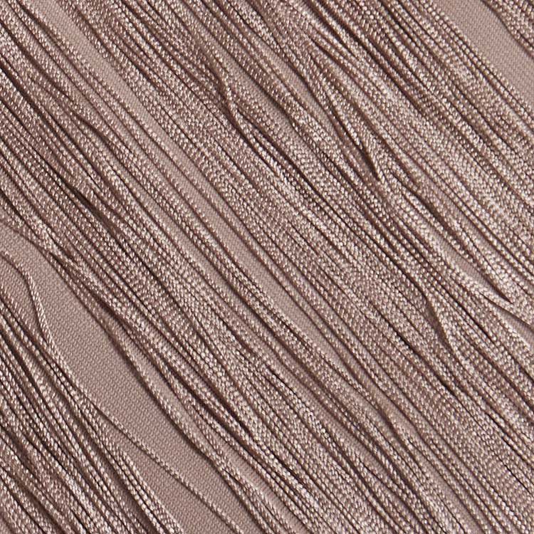 Close-up of elegant sleeveless tassel midi dress fabric with textured tassels for added style