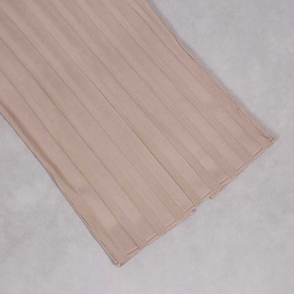 Elegant sleeveless tassel midi dress in soft beige with pleated design for a stylish look