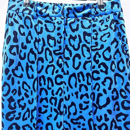 Close-up of women's leopard print velvet pantsuit in blue with bold black leopard spots