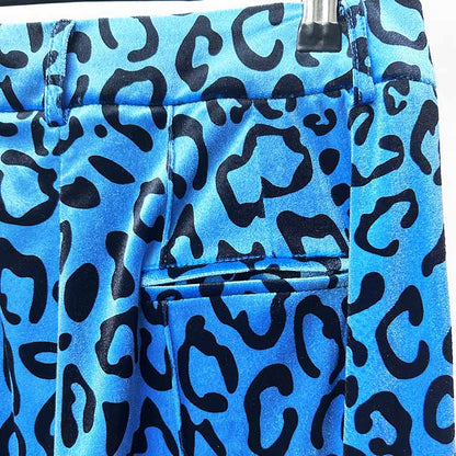 Close-up of women's leopard print velvet pantsuit featuring vibrant blue and black patterns