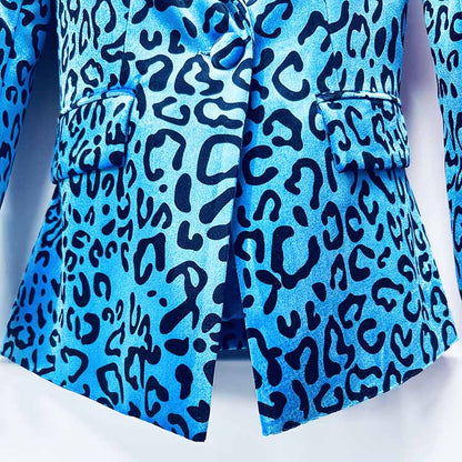 Close-up of women's leopard print velvet pantsuit with bold blue and black patterns and tailored fit