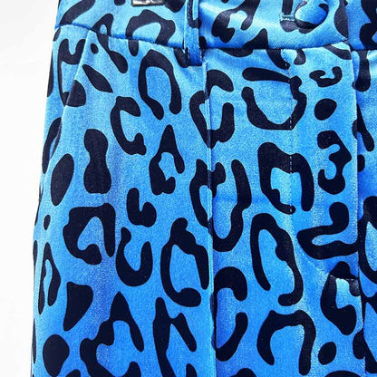 Close-up of women's leopard print velvet pantsuit featuring a bold blue pattern for a stylish look.