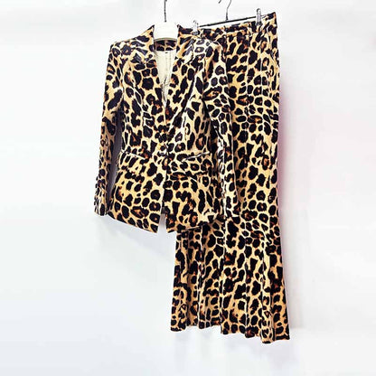 Women's leopard print velvet pantsuit featuring a fitted blazer and pleated skirt for a bold look