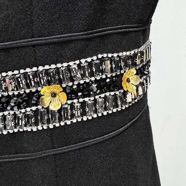 Elegant women's winter wool coat with decorative beaded and floral embellishments on the waist
