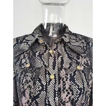 Close-up of an elegant animal print maxi dress for women with button details and stylish collar