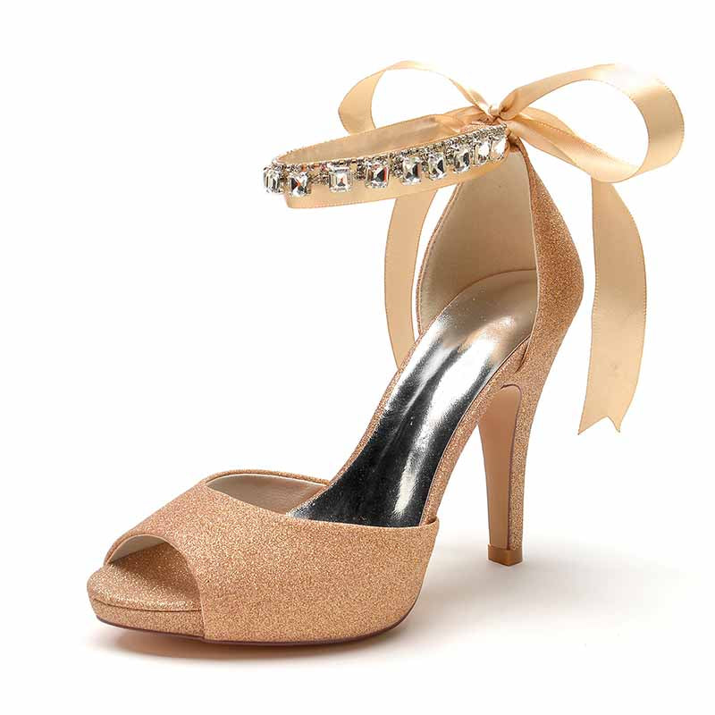 Ankle strap bridal pumps in gold with glitter finish and decorative ribbon for weddings